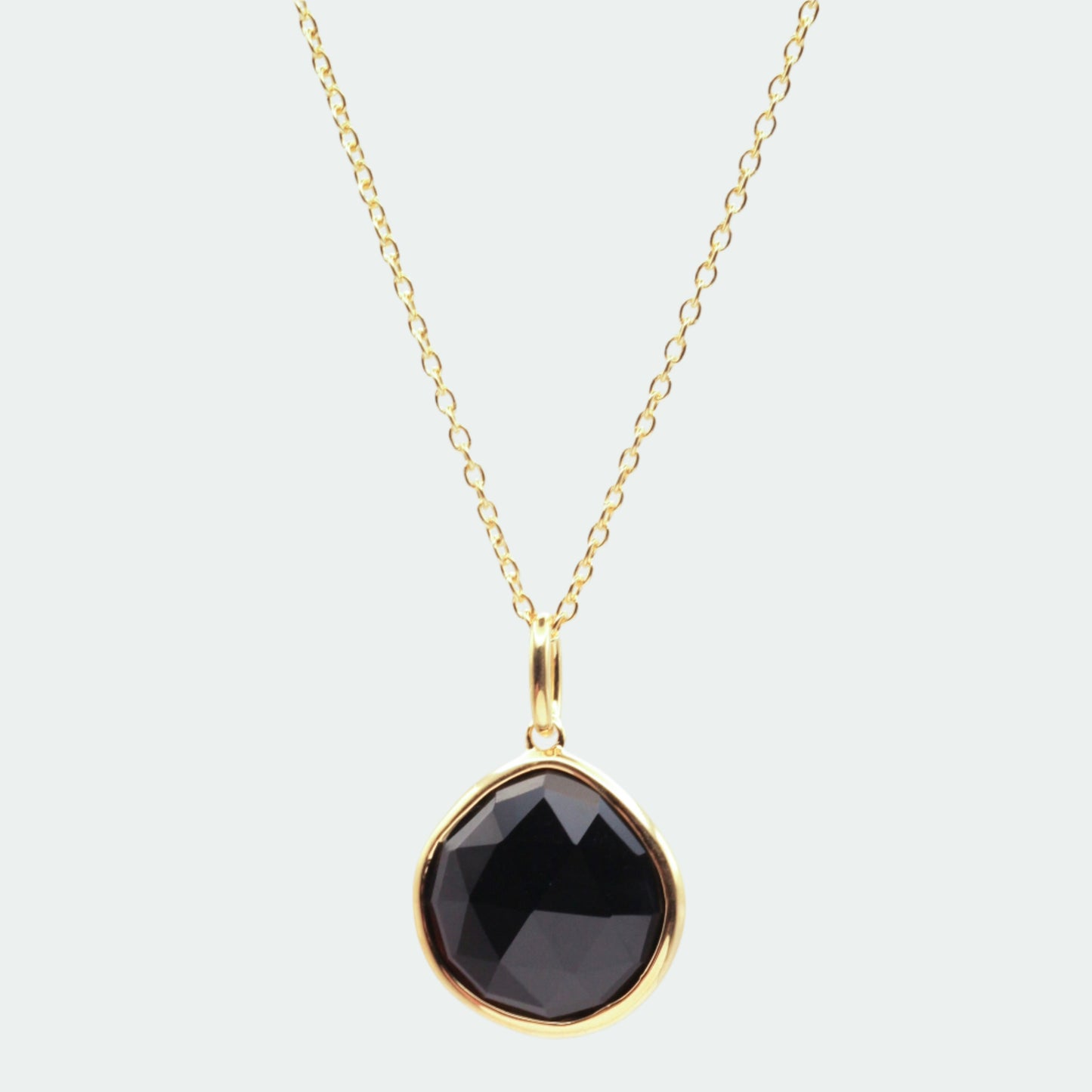 Black onyx gold pear pendant 