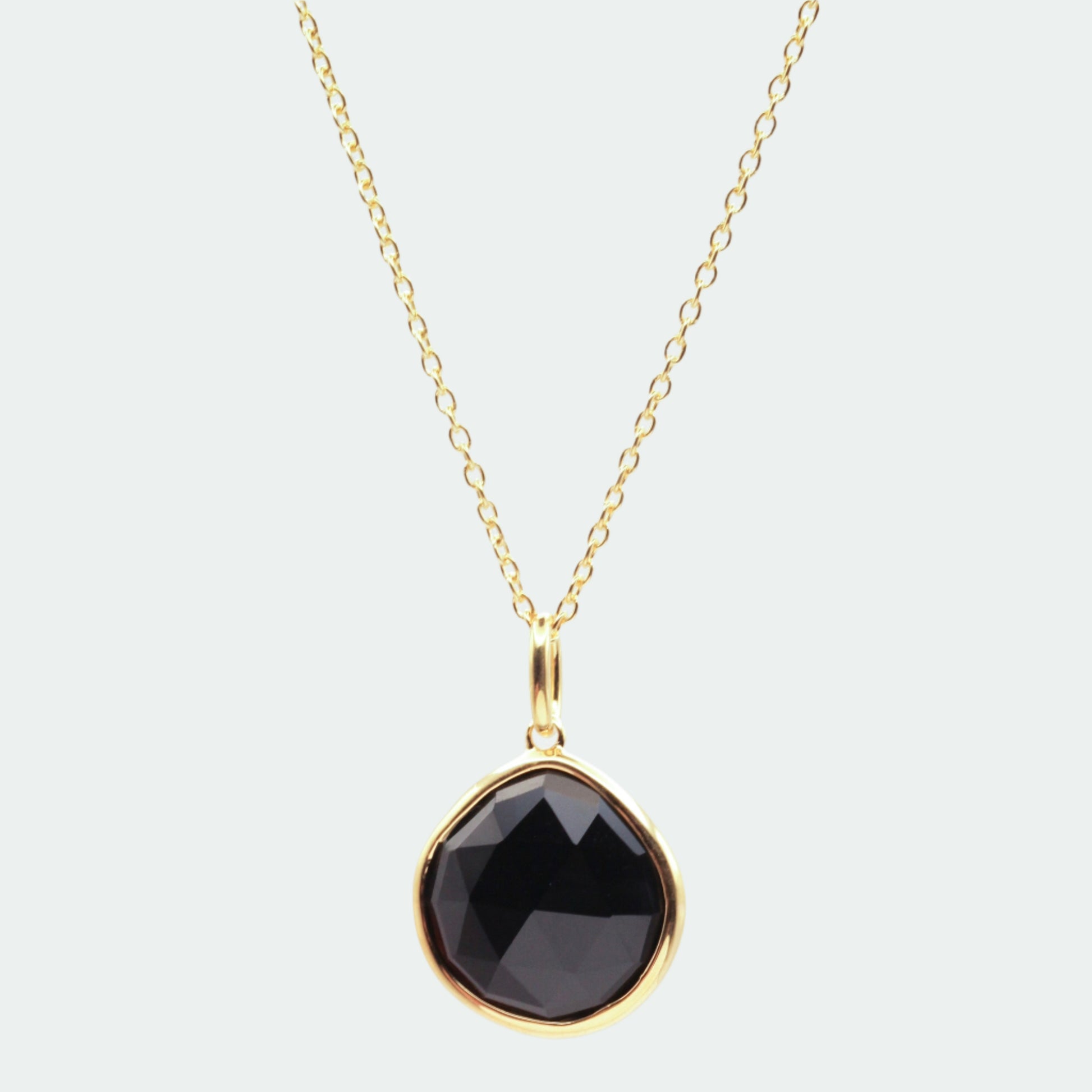 Black onyx gold pear pendant 