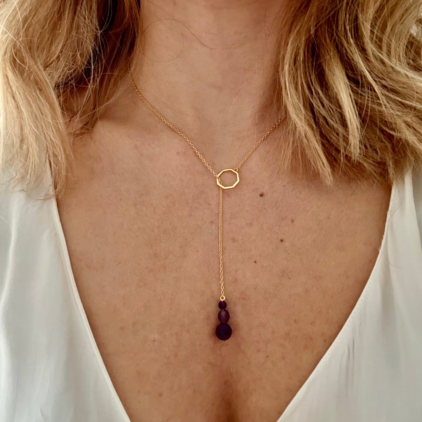 Wearing drop gold necklace amethyst 