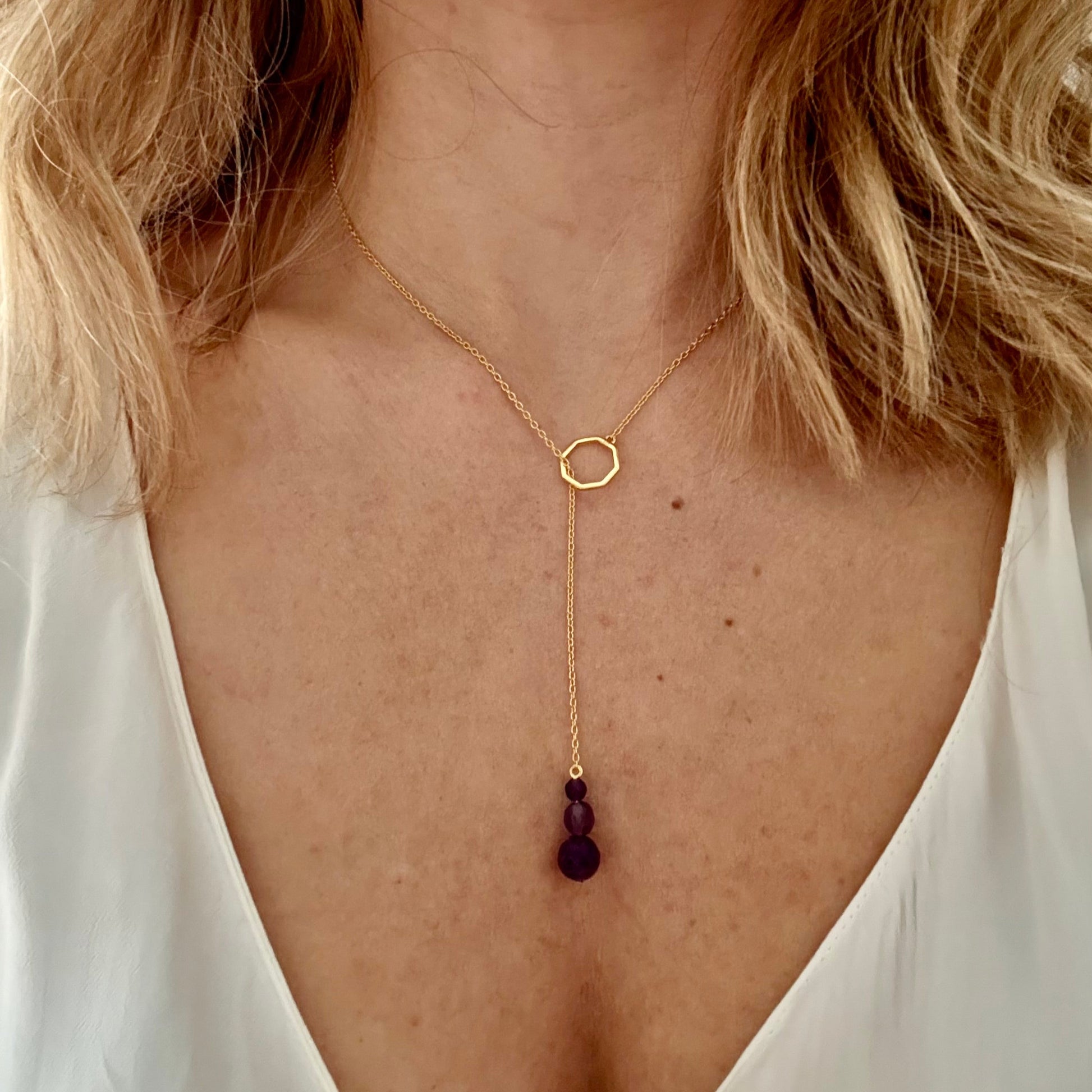 Wearing drop gold necklace amethyst 