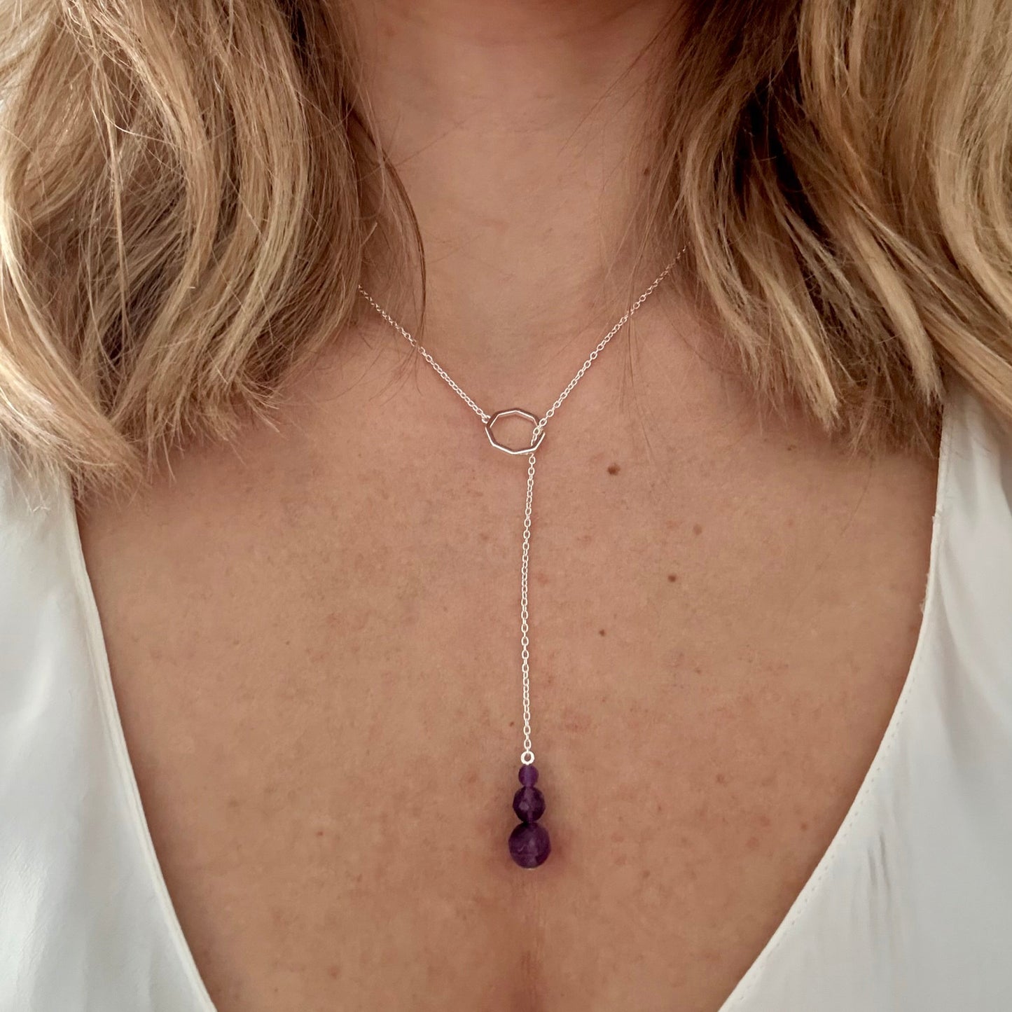 Wearing drop silver necklace amethyst 