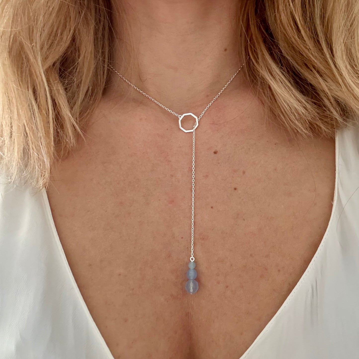 Wearing drop silver necklace aquamarine
