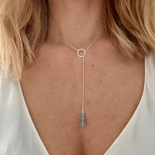 Wearing drop silver necklace aquamarine