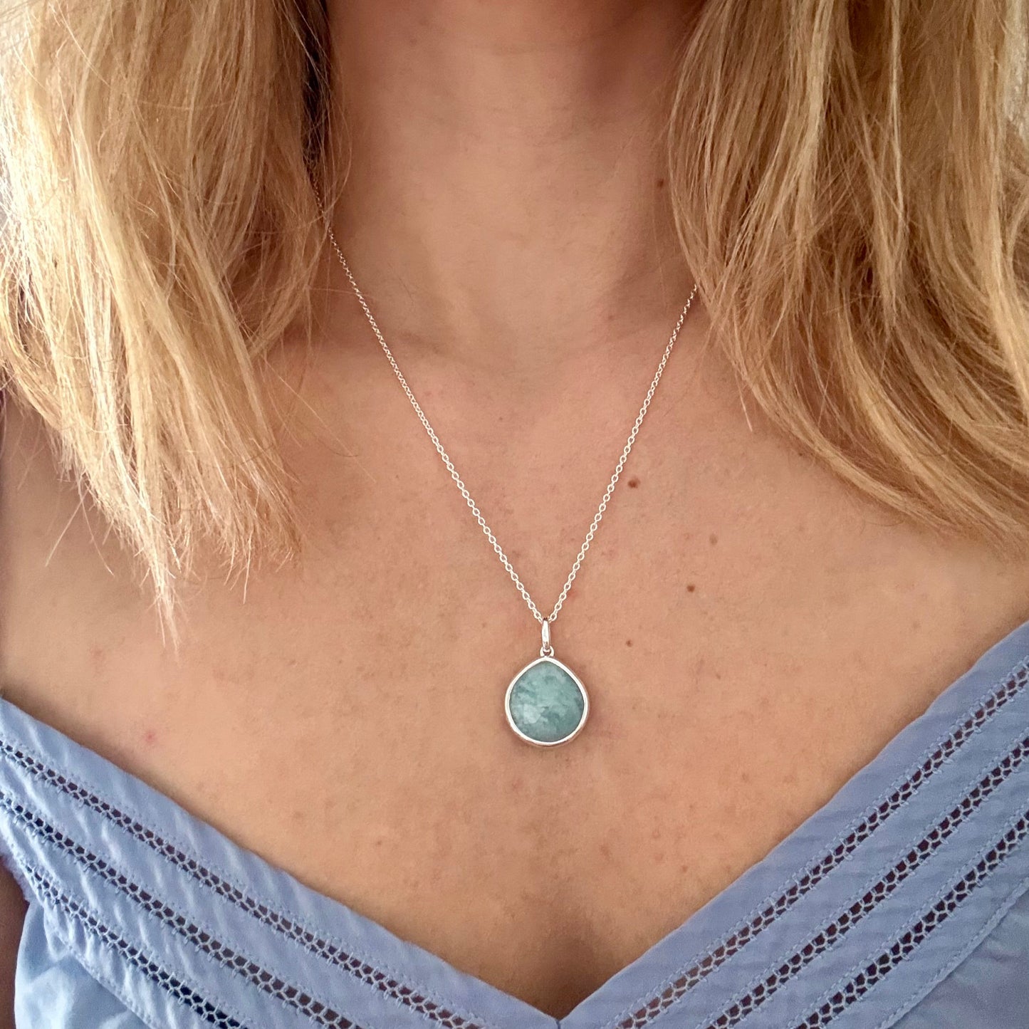 Wearing silver aquamarine pear pendant necklace