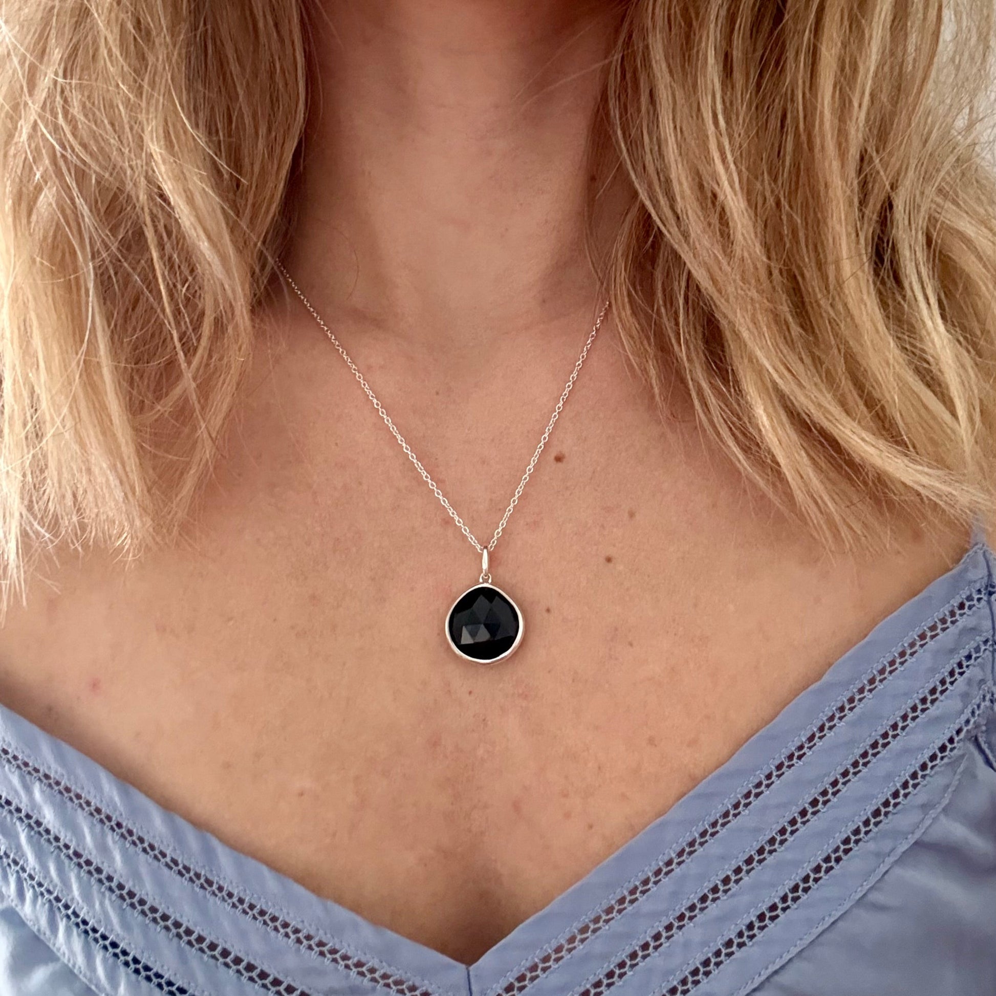Wearing silver black onyx pPear pendant 