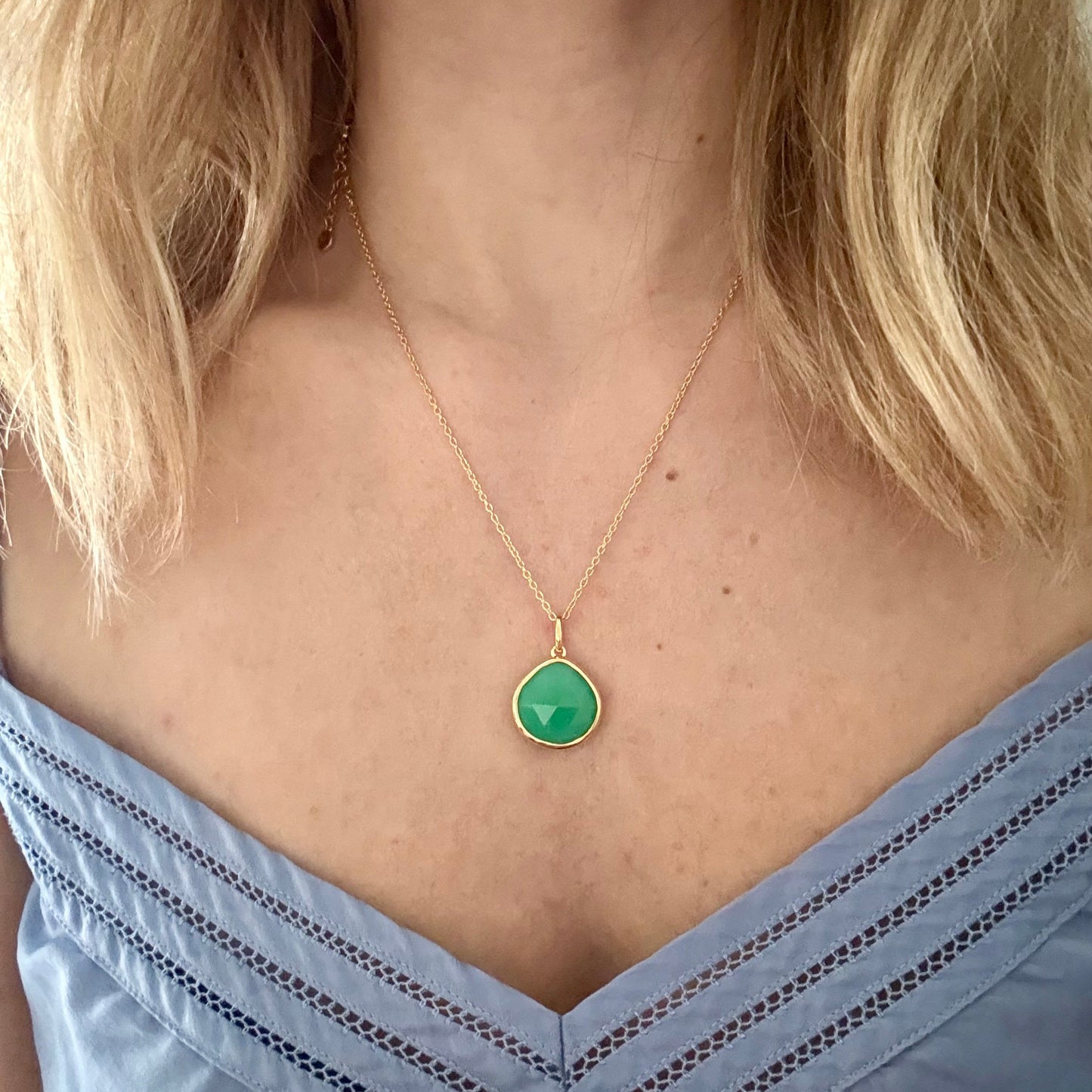 Wearing gold chrysoprase pear pendant