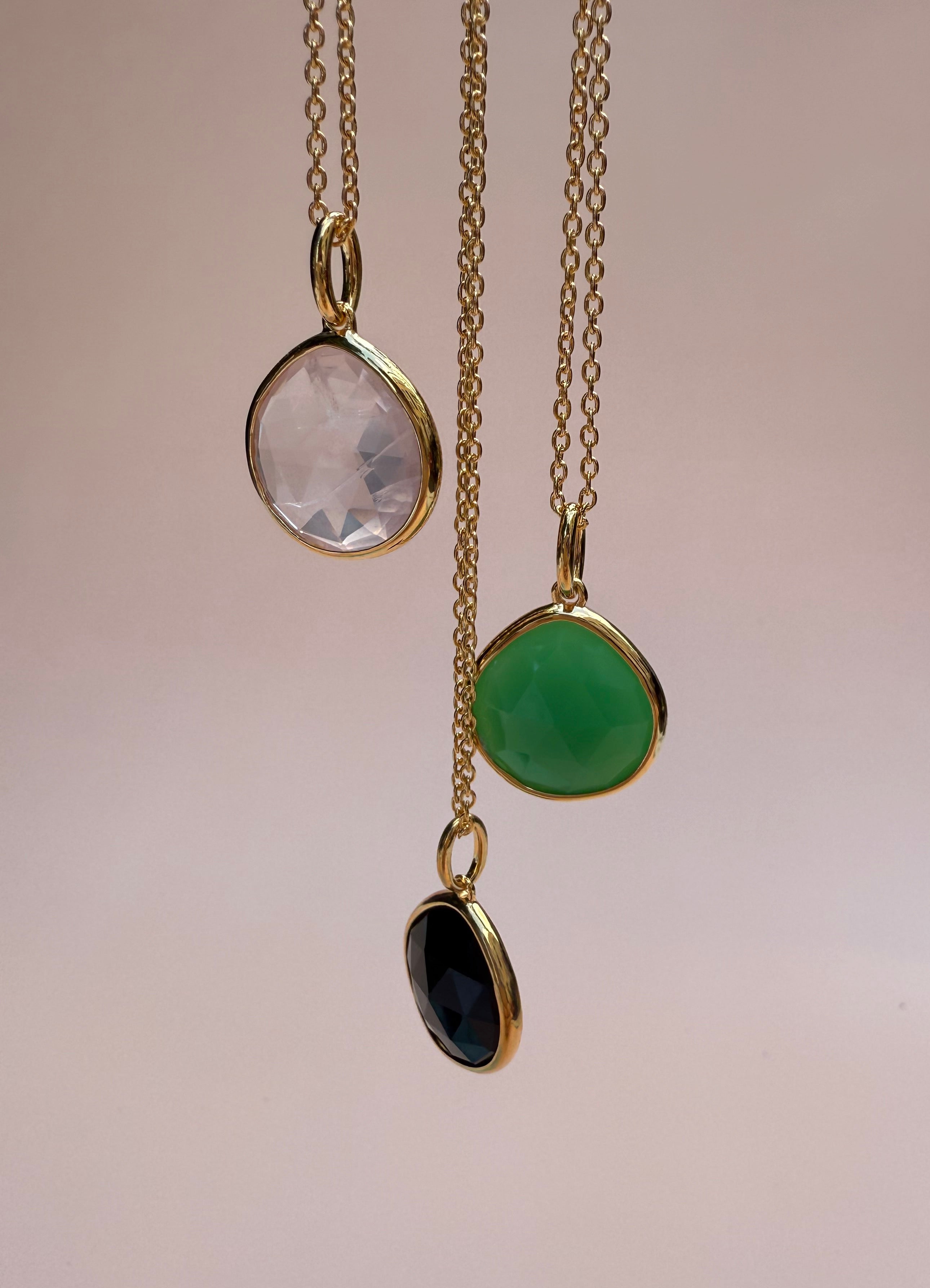 Three gold pendant gemstone necklaces